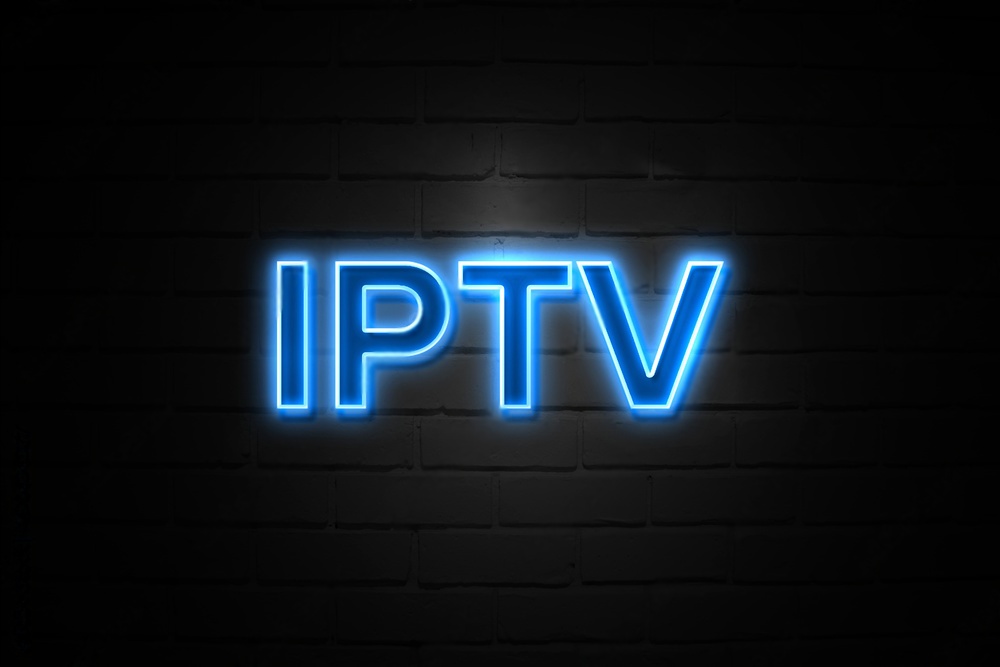 Neon blue IPTV sign on wall